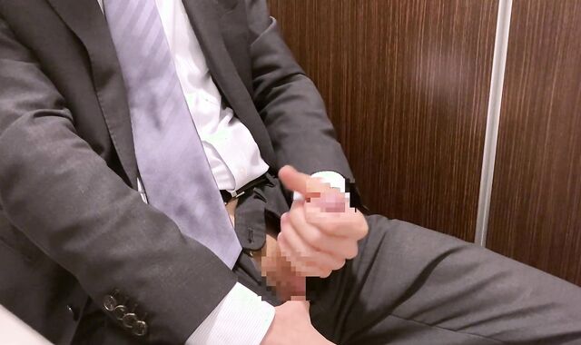 Asian man milking during work