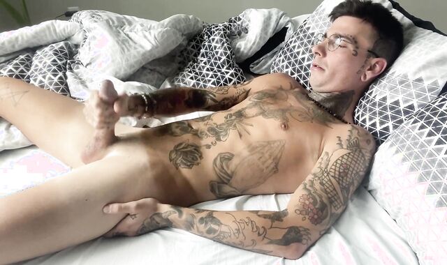 Torrid inked stud shots own jizm into throat