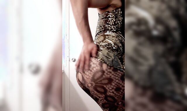 Supah Super-Steamy crossdresser clad in shiny gold dinky-squashing dress