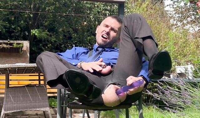 Suited stud is toying with his mancunt in public