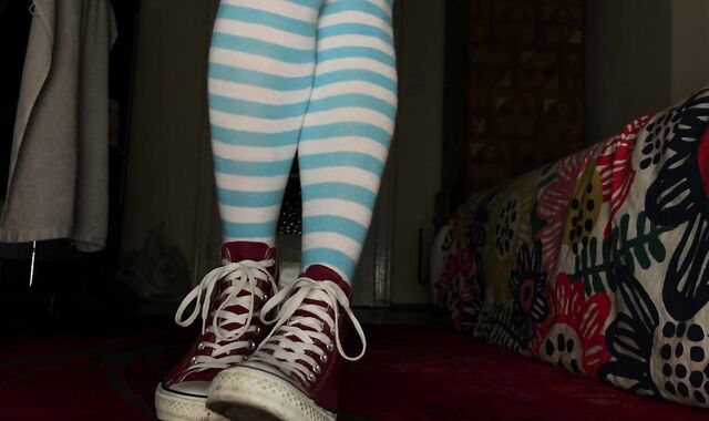 Femboy clothed in Chat, thigh high socks and displaying nude feet