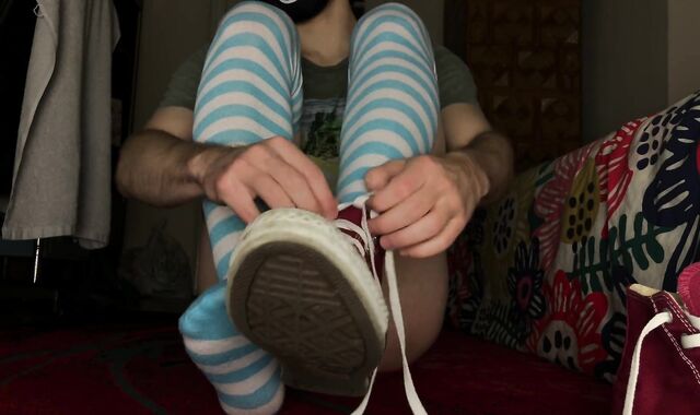 Femboy clothed in Chat, thigh high socks and displaying nude feet