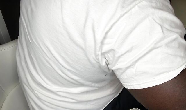 Black Fellow Milks In Office At Desk