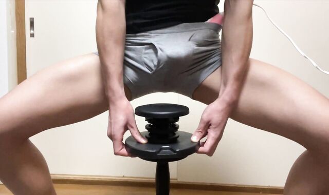 Sporty Japanese masturbates with electric masturbator while doing muscle teaching