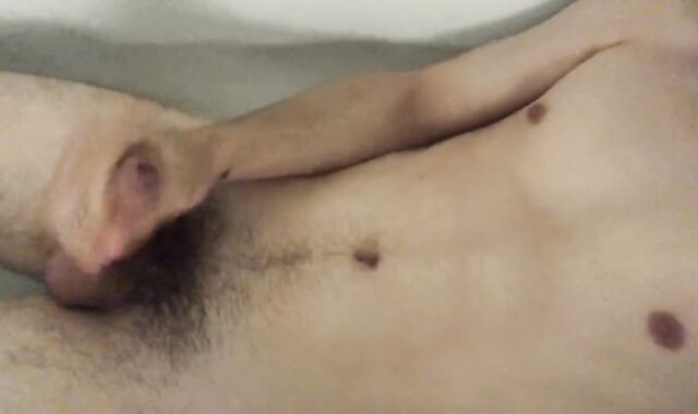 The fellow faps off and finishes off taking a bath