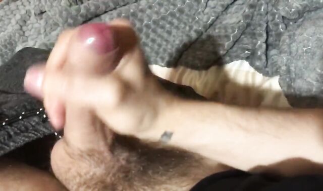 A young stud drains off his stiff-on with lubricant