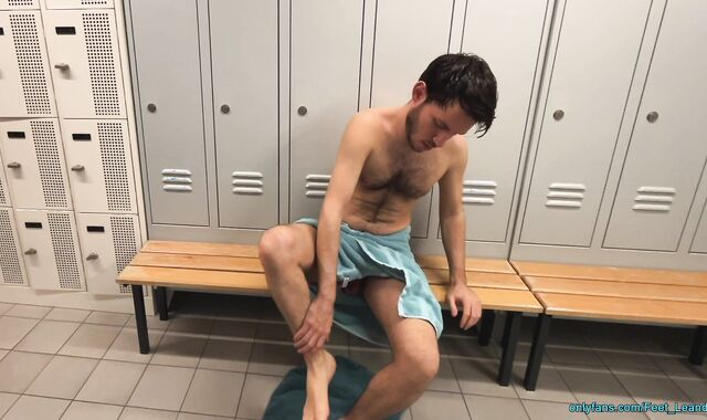 Playing with feet and dick in the locker room