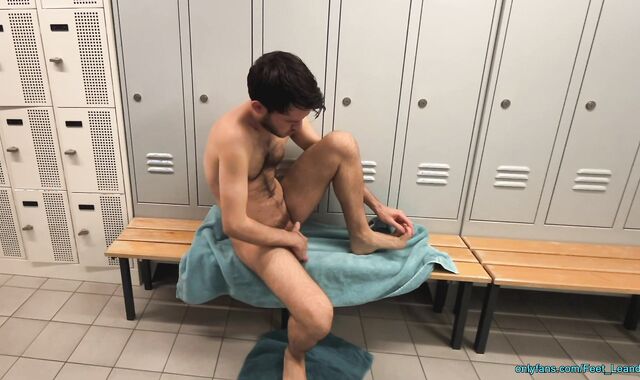 Playing with feet and dick in the locker room