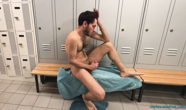 Playing with feet and dick in the locker room