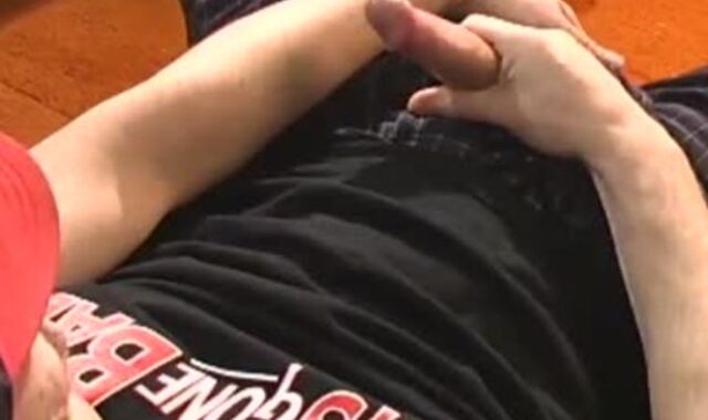 Father lays on the floor and uses a fake-meatpipe