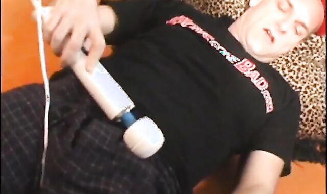 Father lays on the floor and uses a fake-meatpipe