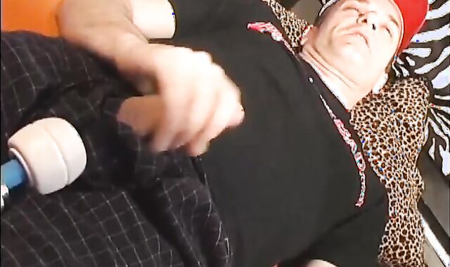 Father lays on the floor and uses a fake-meatpipe