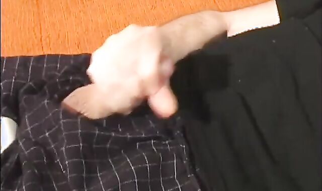 Father lays on the floor and uses a fake-meatpipe