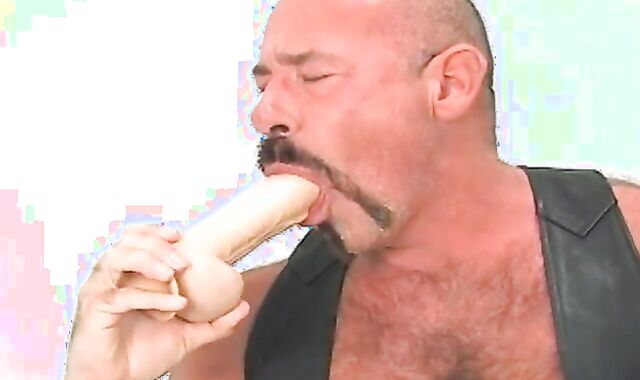 Butch leather dressed in elderly chap w/ fat faux dick