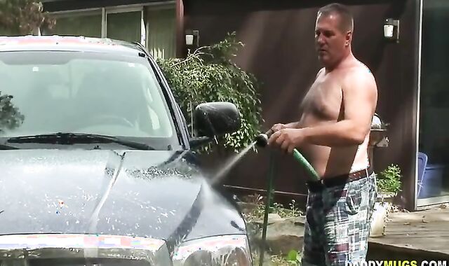 Father Drains Off while Washing Truck
