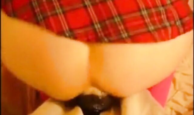 bitch in miniskirt and pink stockings riding her big dildo