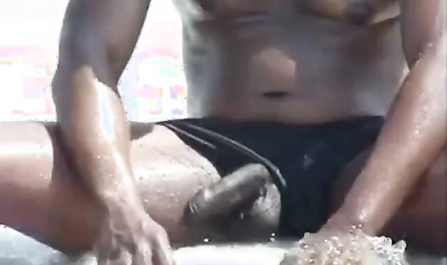 Black Amateur Strokes His Big Cock Outdoors at the Beach