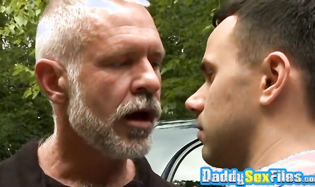 Naughty stud pokes mature dude in missionary posture in public