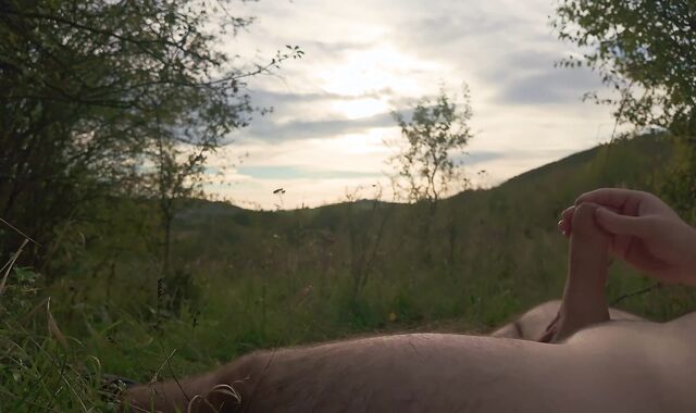 Lazy jack off in nature to the sunset