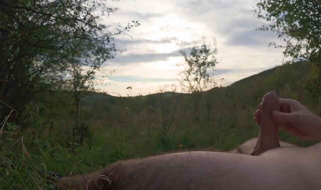 Lazy jack off in nature to the sunset