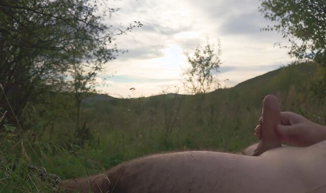Lazy jack off in nature to the sunset