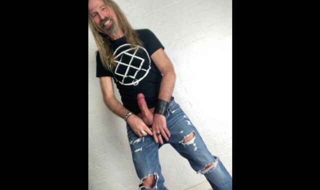 Longhairdude drains and shoots in torns denim, Fresh Rock biker shoes, tshirt
