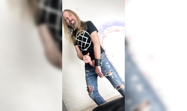 Longhairdude drains and shoots in torns denim, Fresh Rock biker shoes, tshirt