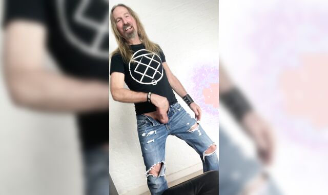 Longhairdude drains and shoots in torns denim, Fresh Rock biker shoes, tshirt