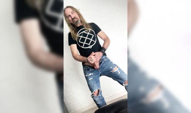 Longhairdude drains and shoots in torns denim, Fresh Rock biker shoes, tshirt