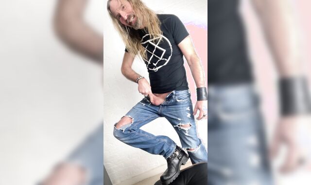 Longhairdude drains and shoots in torns denim, Fresh Rock biker shoes, tshirt