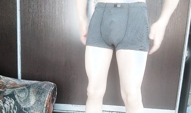 Femboy puts on a cell and poses a tiny