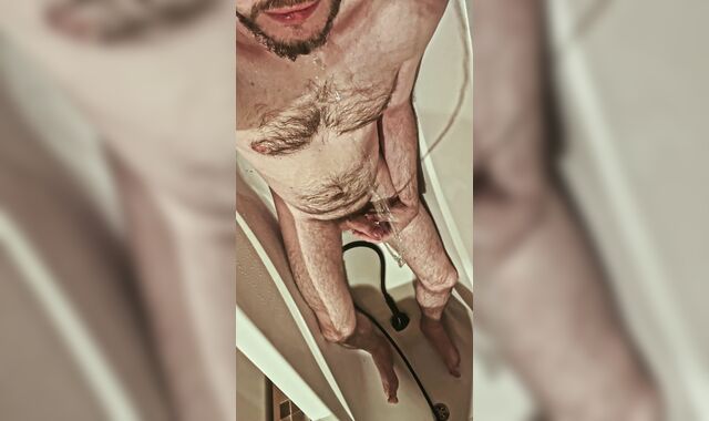 Fur covered uncircumcised boy urinates on himself and in his jaws, tastes his own urinate in the shower