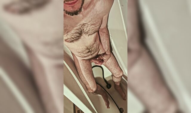 Fur covered uncircumcised boy urinates on himself and in his jaws, tastes his own urinate in the shower