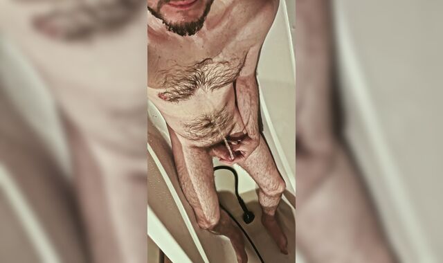 Fur covered uncircumcised boy urinates on himself and in his jaws, tastes his own urinate in the shower