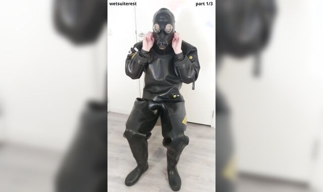 Putting on powerful protection Viking drysuit, gasmask, spandex mask and rubber