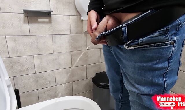 The boy takes a selfie as plentifully lengthy peeing in the restroom