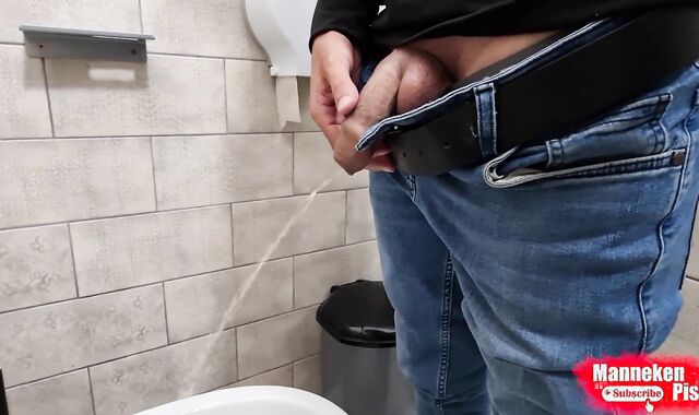 The boy takes a selfie as plentifully lengthy peeing in the restroom