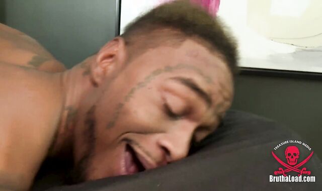 Licking some dark-hued bootie